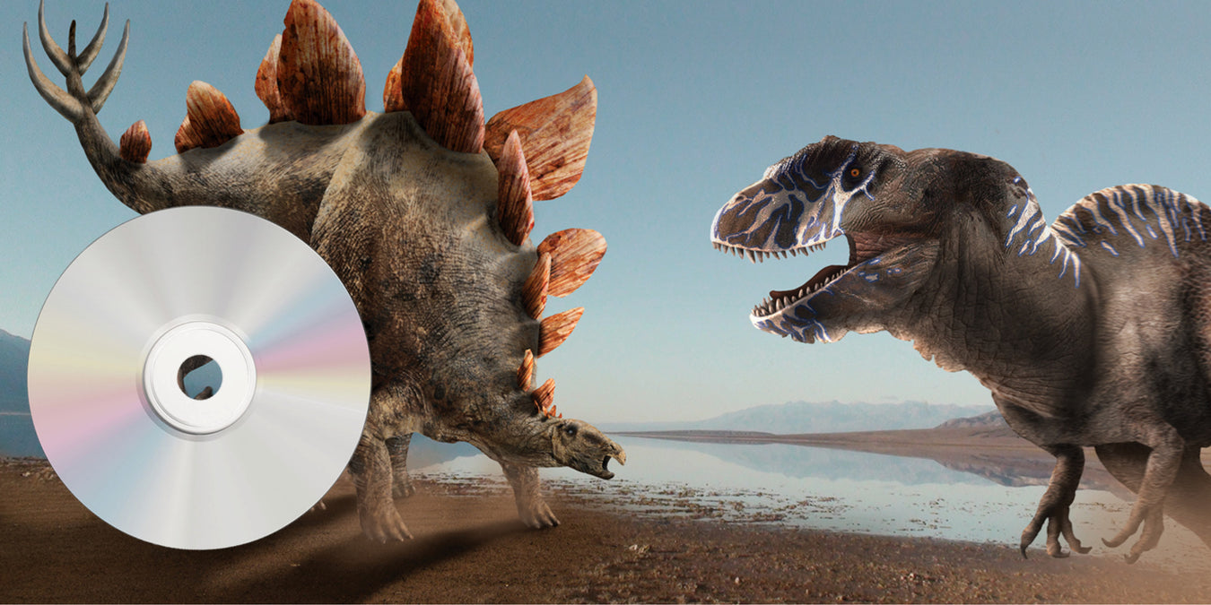 Oz Publishing audio big book banner showing dinosaurs stegosaurus and allosaurus
